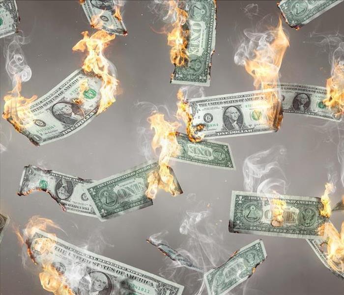 dollar bills flaming, many